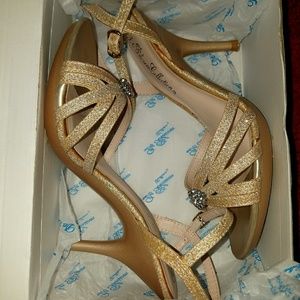 A pair of champagne Sparkle open-toe shoes